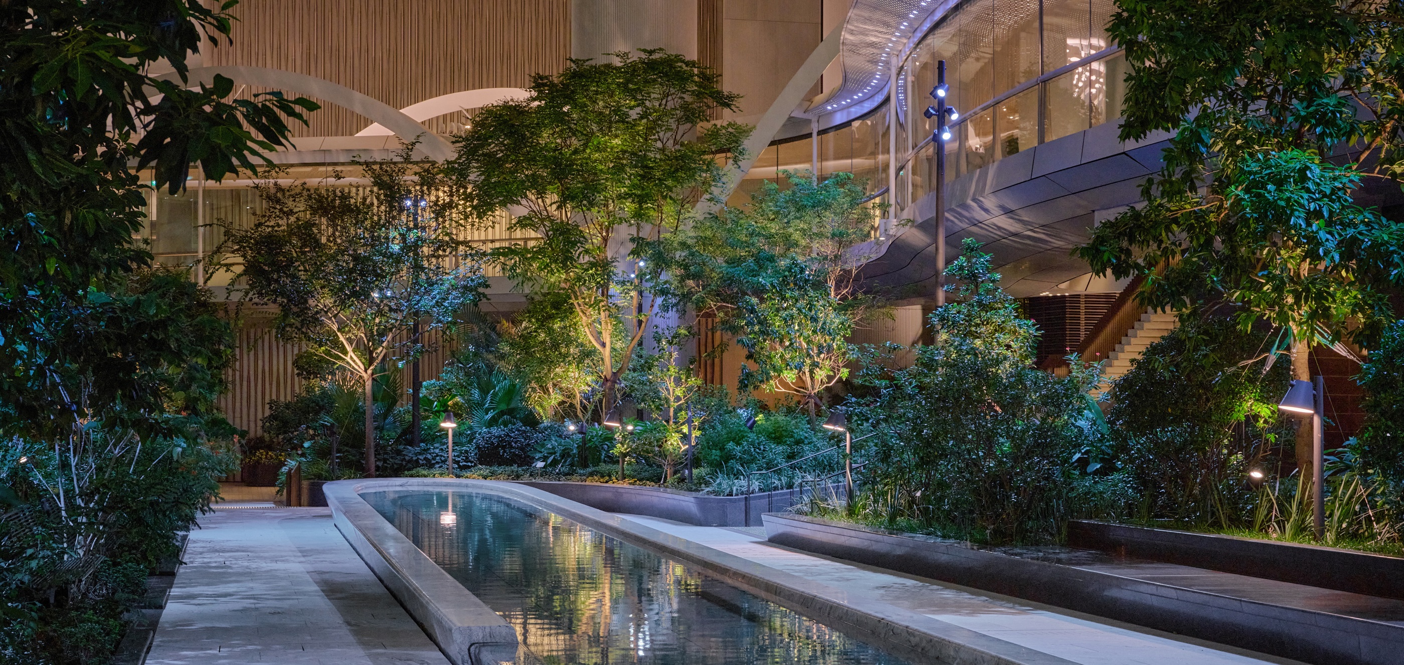 Taikoo Place makes a dense urban landscape feel generous at night.