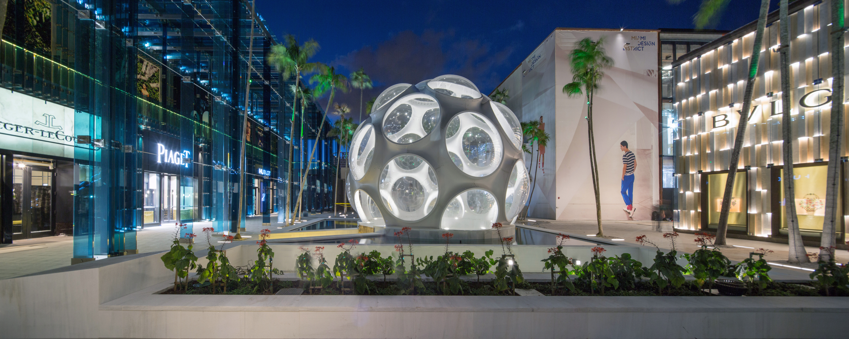 Palm Court lets a glowing geometric object anchor its public space.